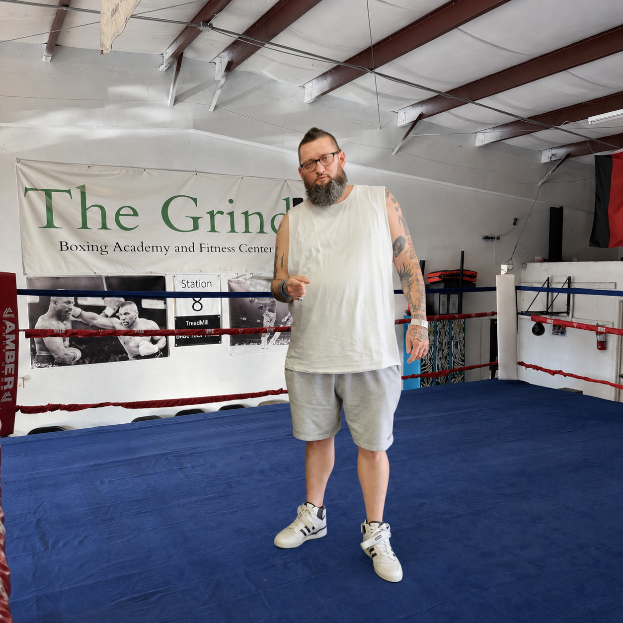 Coach Derek standing inside The Grind Boxing Academy ring