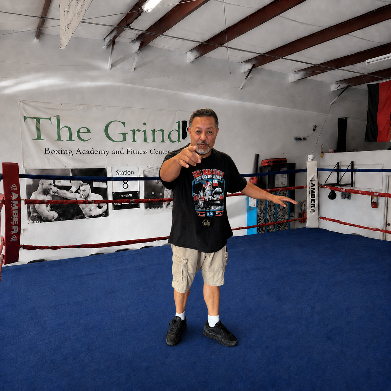 Coach Jaime standing inside The Grind Boxing Academy ring