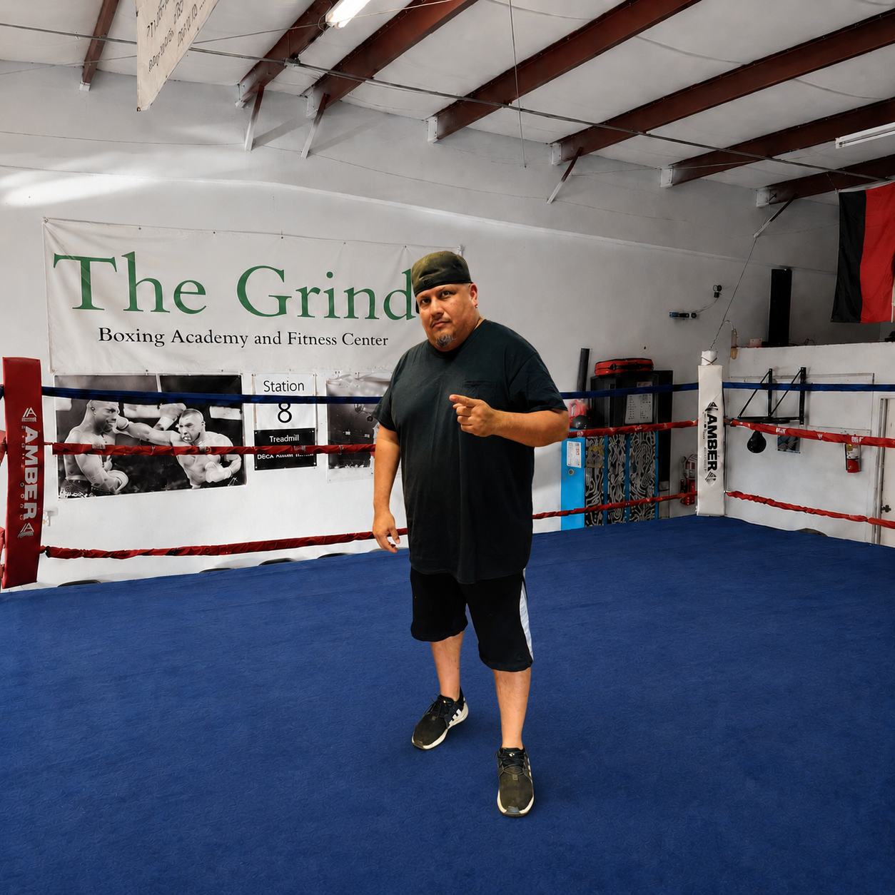 Coach Joe standing inside The Grind Boxing Academy ring