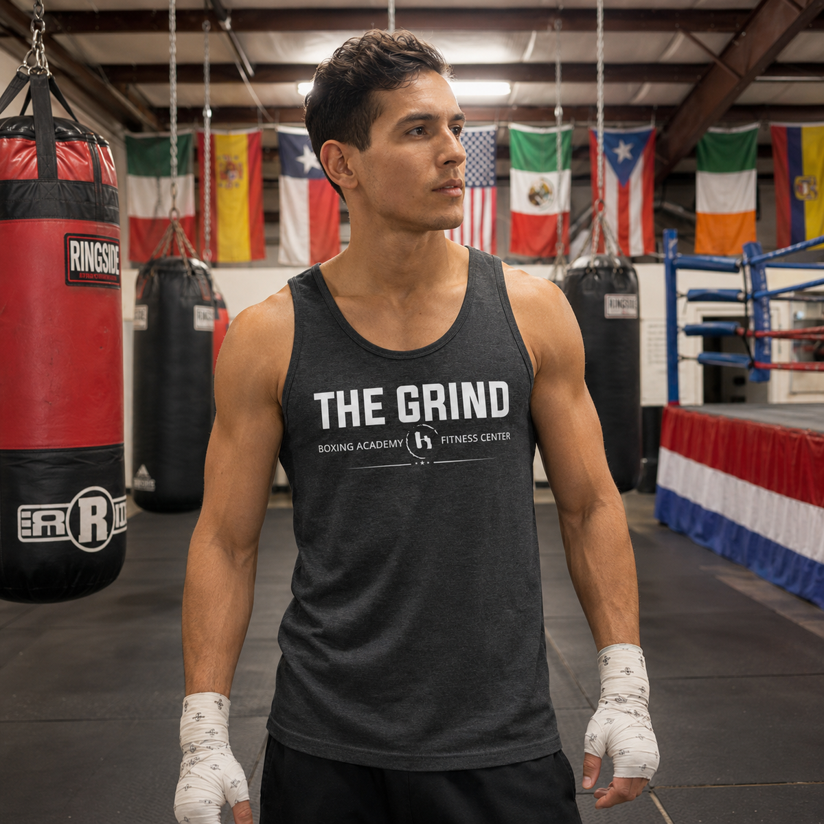 Model wearing The Grind Boxing Academy tank top inside The Grind gym
