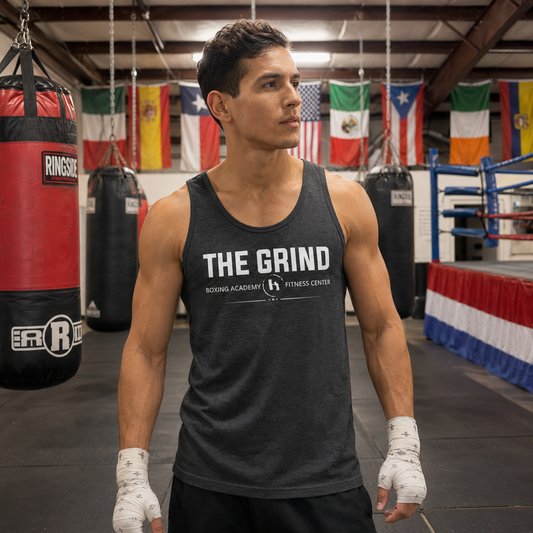 Model wearing The Grind Boxing Academy tank top inside The Grind gym